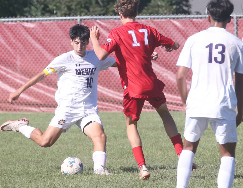 Mendota's Johan Cortez kicks the ball ahead of Streator's Dalton Sliker on Saturday, Aug. 31, 2024 at James Street Recreation Area in Streator.