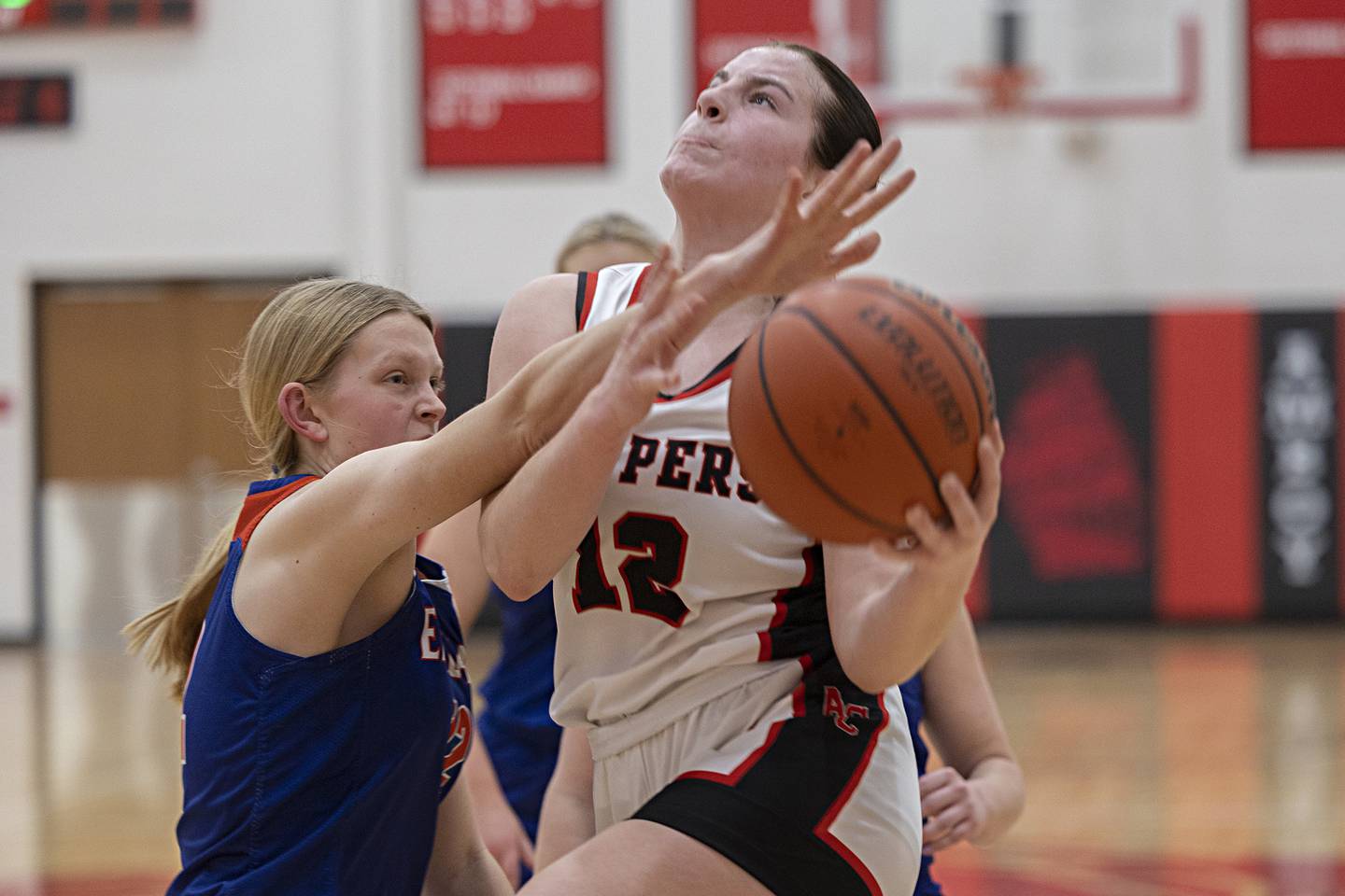 Amboy’s Addison Pertell gets fouled going to the hoop against Eastland’s Ella Gunderson Friday, Jan. 19, 2024 at Amboy High School.