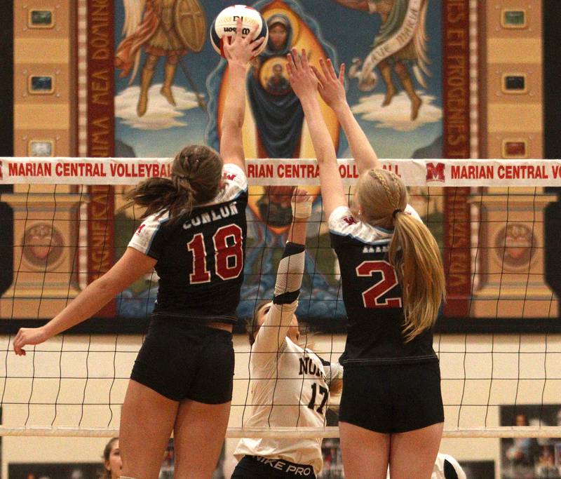 Grayslake North’s  Maddie Von Allmen, center, watches her tip against Marian Central in girls volleyball in Woodstock Monday.