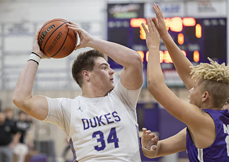 Dixon’s Matthew Warkins looks to pass Monday, Dec. 5, 2022 in a game against Rochelle.