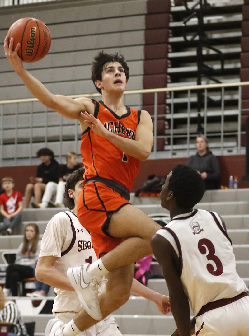 McHenry's Marko Visnjevac drives to the basket against McHenry's Marko Stojich during a nonconference basketball game Thursday, Jan. 4. 2024, at Antioch High School.