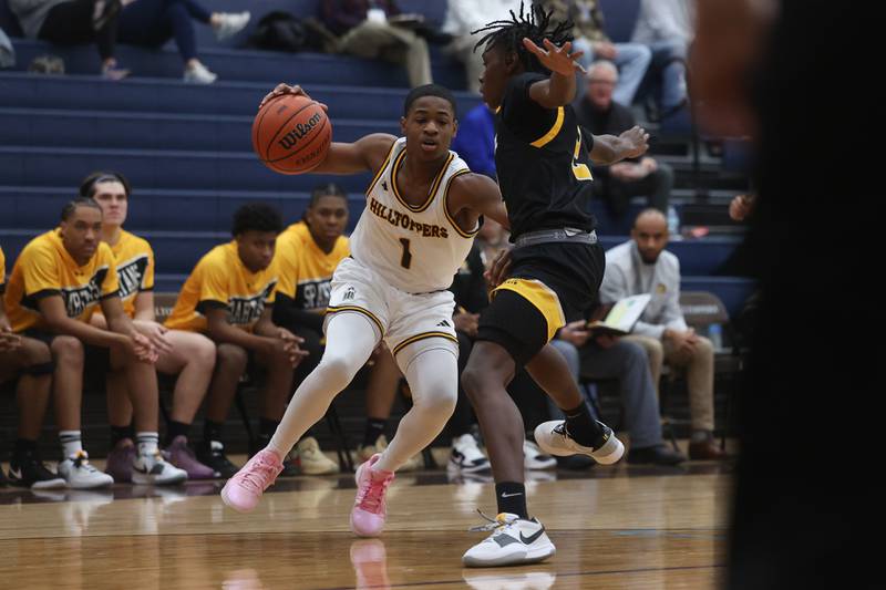 Joliet Catholic’s Jayden Armstrong makes a move against Marian Catholic on Saturday, Jan. 6th, 2024 in Joliet.
