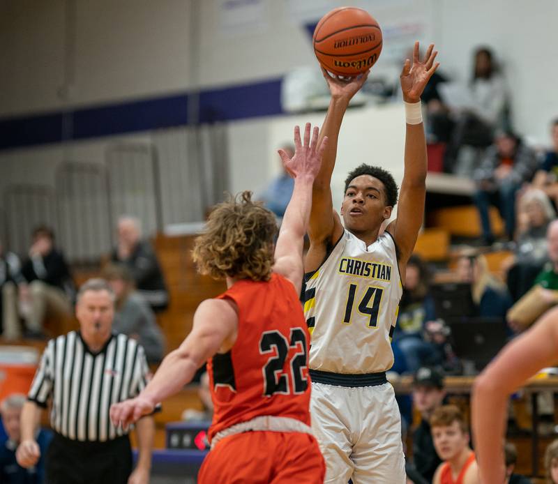 Yorkville Christian's David Douglas Jr (14) shoots a three-pointer over Sandwich’s Austin Marks (22) during the 59th Annual Plano Christmas Classic basketball tournament at Plano High School on Tuesday, Dec 27, 2022.