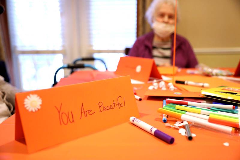 Brighton Gardens of St. Charles resident Mabel Clements creates a kindness table sign for Lazarus House shelter, St. Charles Public Library and River Crossing senior living facility as part of the sixth annual Random Acts of Kindness Week sponsored by Random Acts Matter, a volunteer organization committed to sharing care and compassion in St. Charles.