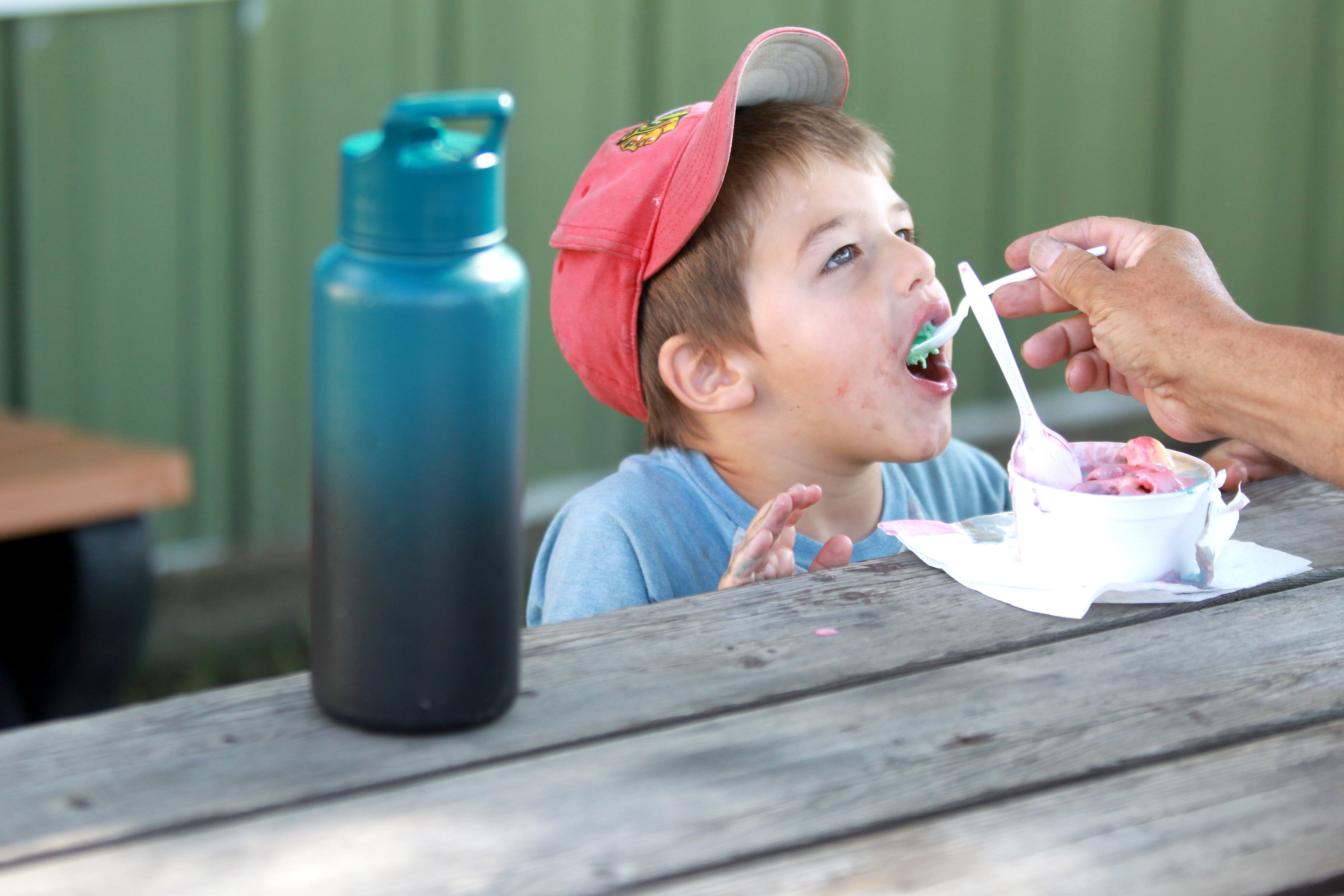 Bennett De Swardt, 3, eats ice cream at the 4-H Foundation ice cream booth during opening day of the 155th Kane County Fair opened in St. Charles on Wednesday, July 17, 2024. The fair runs through Sunday, July 21, 2024.