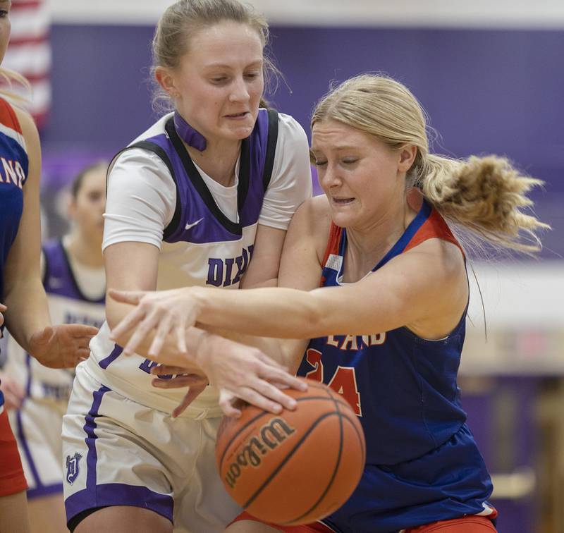 Dixon’s Katie Drew and Eastland’s Lily Mullen fight for a  loose ball Wednesday, Jan. 24, 2024 at Dixon High School.