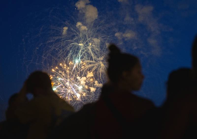 Spectators watch as fireworks illuminate the sky Monday, July 3, 2023 at Petunia Fest in Dixon. 90’s rock band Everclear finished off the weekend after the fireworks with a show on the main stage in downtown Dixon.