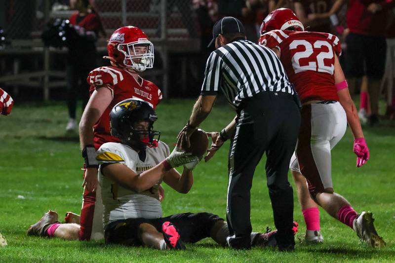 Gaege Heinsen of Riverdale hands referee ball after being tacked on Friday, October 18, 2024 at Richard Nesti Stadium in Spring Valley.