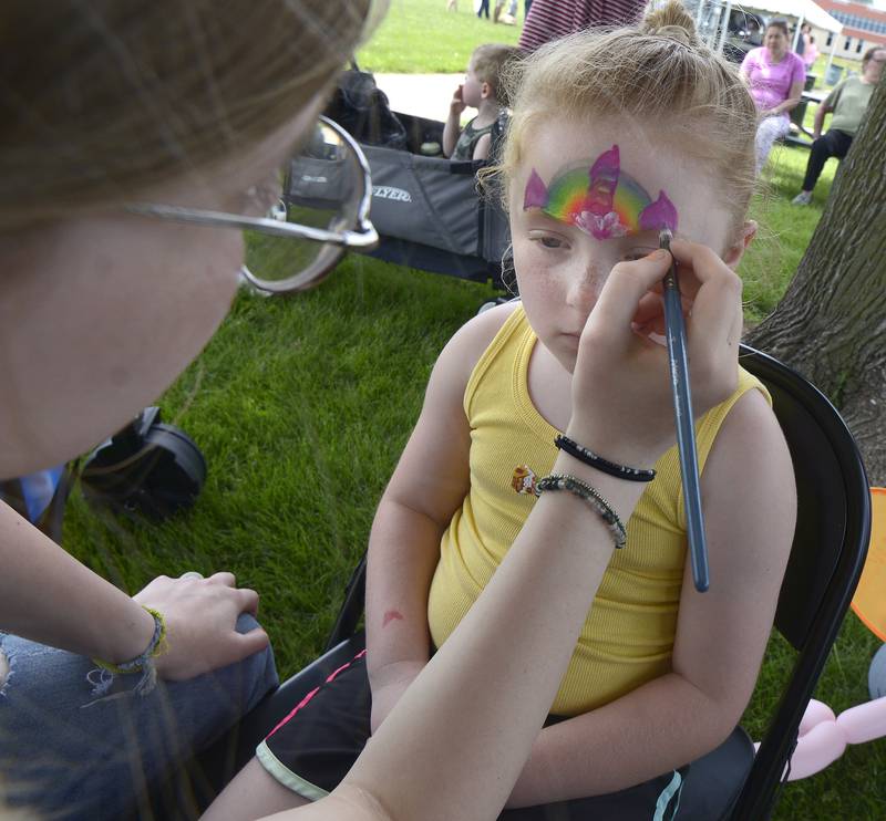 Lily Harrison gets her face painted during Kites in Flight at Ottawa’s Riverfront Saturday.