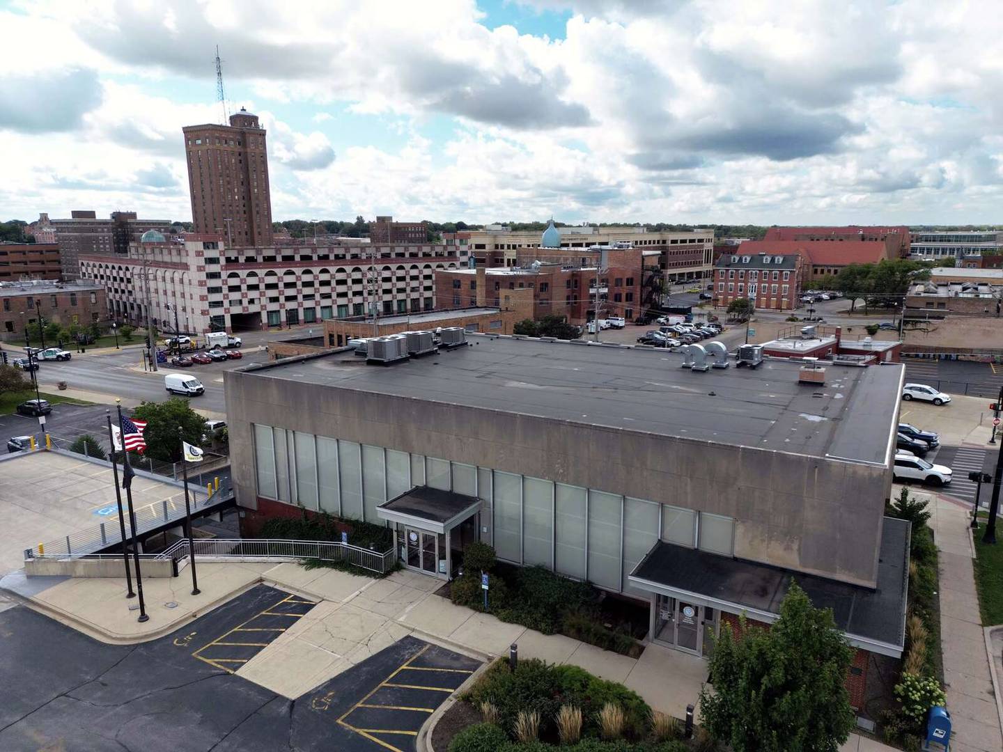 A proposed 4,000-seat theater would go on a city-owned block that once housed a bank at New York and Lake streets in downtown Aurora.