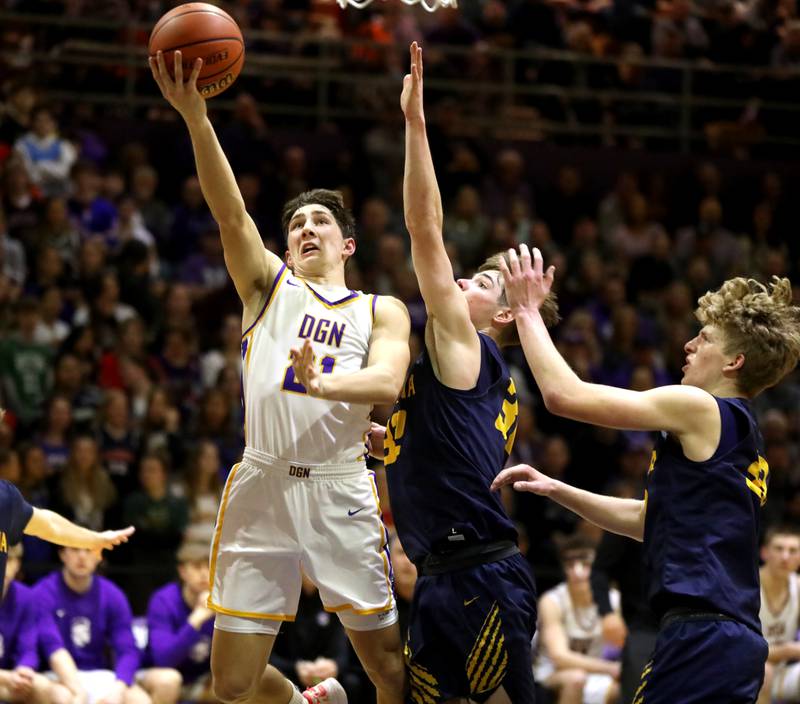 Downers Grove North’s Jack Stanton gets the ball to the basket during the Class 4A Downers Grove North Regional final against Neuqua Valley on Friday, Feb. 23, 2024.