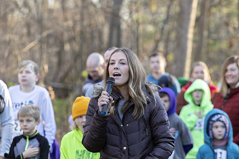 Jaselyn Nagy sings the national anthem Thursday, Nov. 23, 2023 at the start of the St. Anne’s Turkey Trot at Lowell Park in Dixon.