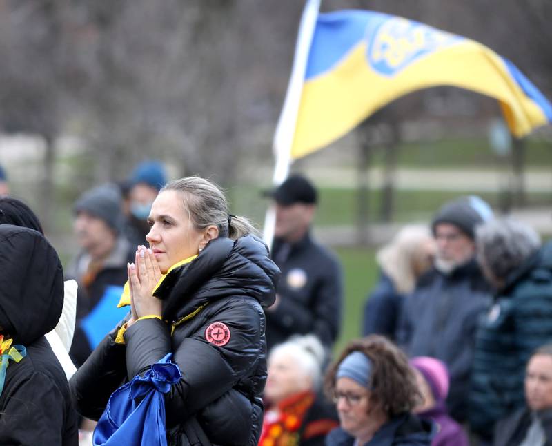 Roksolana Levkovych, who is from Ukraine, attends a vigil in support of the people of Ukraine at Wilder Park in Elmhurst on Wednesday, April 6, 2022. The event was organized by the City of Elmhurst, Elmhurst District 205, Elmhurst Park District, Elmhurst Public Library and Elmhurst University.