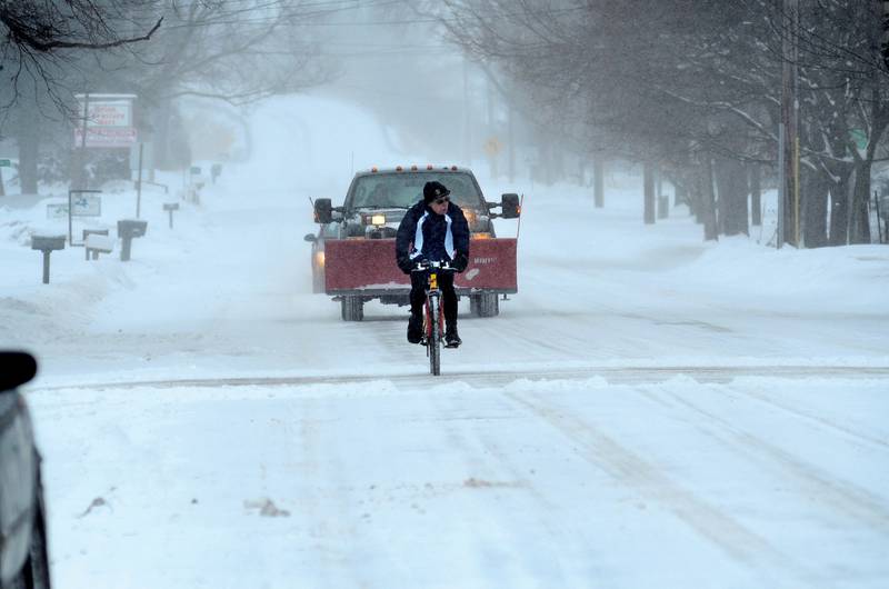 A day better set for snow plows and skis doesn't stop BJ Fenwick from continuing a New Years Day tradition Jan. 1, 2014 of taking his bicycle out for a ride. A member of the Rock River Valley Bicycle Club, Fenwick was the only one to make the snowy trek around Dixon.