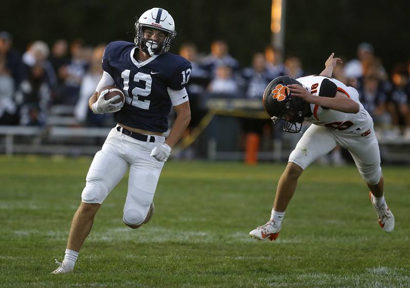 Cary-Grove's Landon Barnett breaks a way for a long run during a Fox Valley Conference football game against Crystal Lake Central on Friday, Sept. 6, 2024, at Cary-Grove High School in Cary.