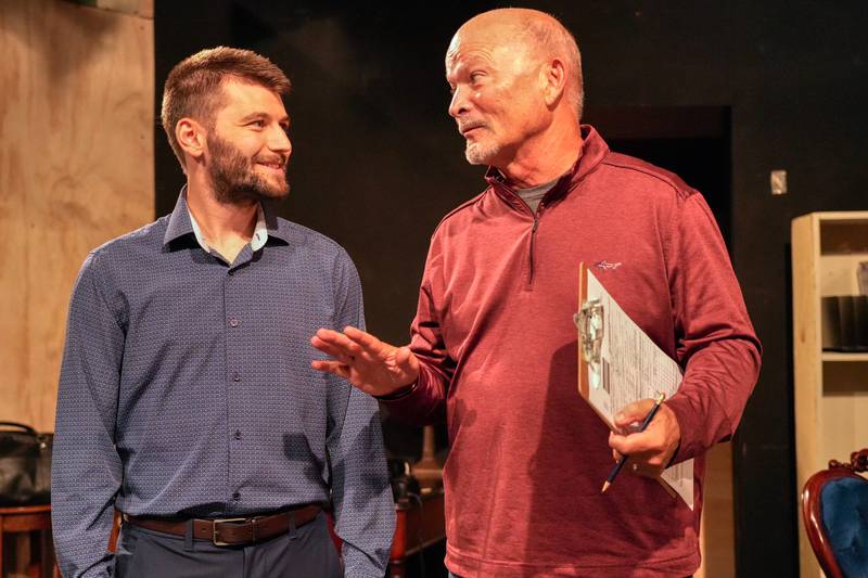 Dr. Tennyson (Michael Ferrarelli) confers with Dr. Cook (John Vinopal) in "Dr. Cook's Garden" at Village Theatre Guild [L to R: Michael Ferrarelli, John Vinopal]  Oct-nov. 9 2024 [Photo credit: David Dowell]