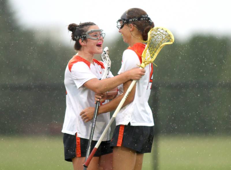 Crystal Lake Central’s Addison Bechler, right, is greeted by Colleen Dunlea after a Bechler goal  against Lake Forest during girls lacrosse supersectional action at Metcalf Field on the campus of Crystal Lake Central Tuesday.