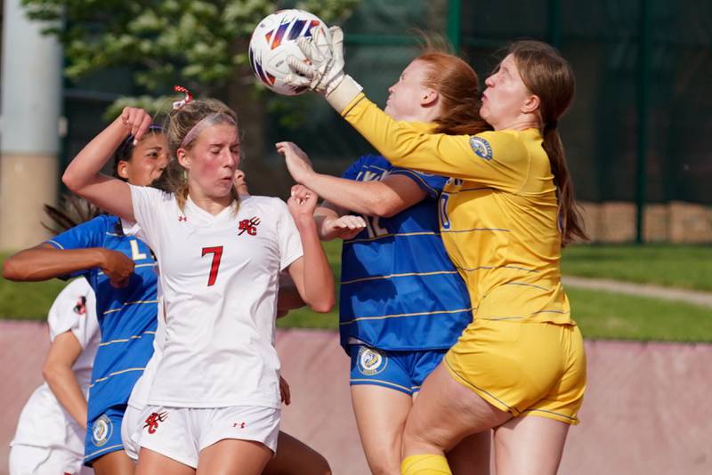 Lyons’ Anna Bigenwald (right) goes up for a save against Downers Grove North's Audrey Anderson (7) during a Class 3A Hinsdale Central Sectional semifinal soccer match at Hinsdale Central High School in Hinsdale on Tuesday, May 21, 2024.