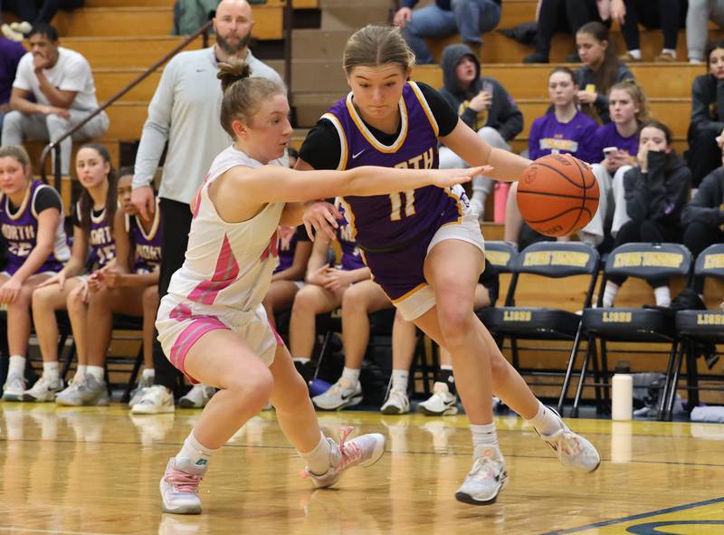 Downers Grove North’s Abby Gross (11) drives to the basket against Lyons Township during the girls varsity basketball game on Tuesday, Jan. 16, 2024 in La Grange, IL.