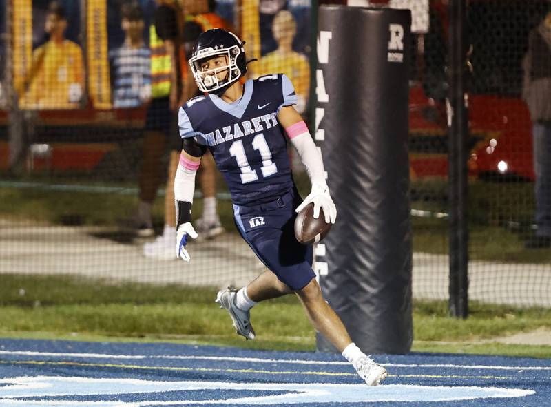 Nazareth's James Penley (11) gets into the endzone for a touchdown during the varsity football game between Benet and Nazareth academies on Friday, Oct. 18, 2024 in La Grange Park.