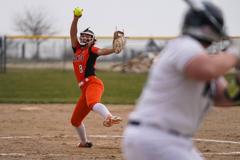 St. Charles East's Grace Hautzinger (8) delivers a pitch against Oswego East during a softball game at Oswego East High School on Wednesday, March 13, 2024.