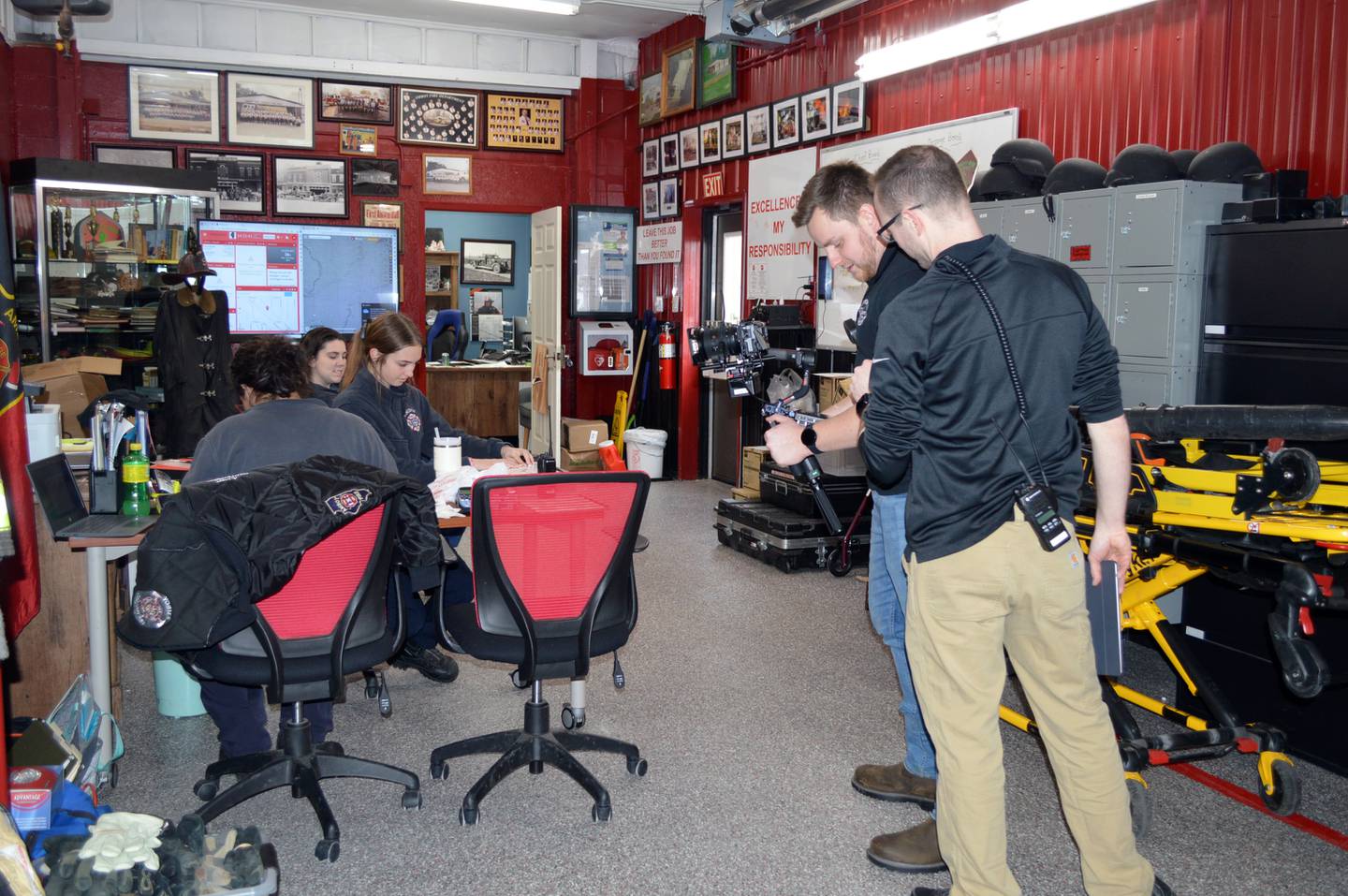 Daniel McMullen, far right, and Mitchell Losey, of Woven Film Co., of Loves Park, film Amboy Fire Protection District staff working for a recruitment video on Wednesday, Jan. 31, 2024, at the Amboy fire station.