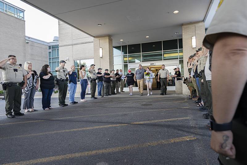 Lt. Jason Ketter is saluted as he leaves OSF Medical Center in Rockford on Friday, June 14, 2024. Ketter walked out with family and Ogle County Sheriff Brian VanVickle. Ketter was shot in the line of duty two days earlier in Lost Nation, near Dixon.