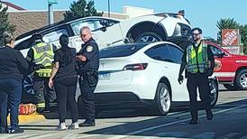 McHenry crash leaves one car on top of another