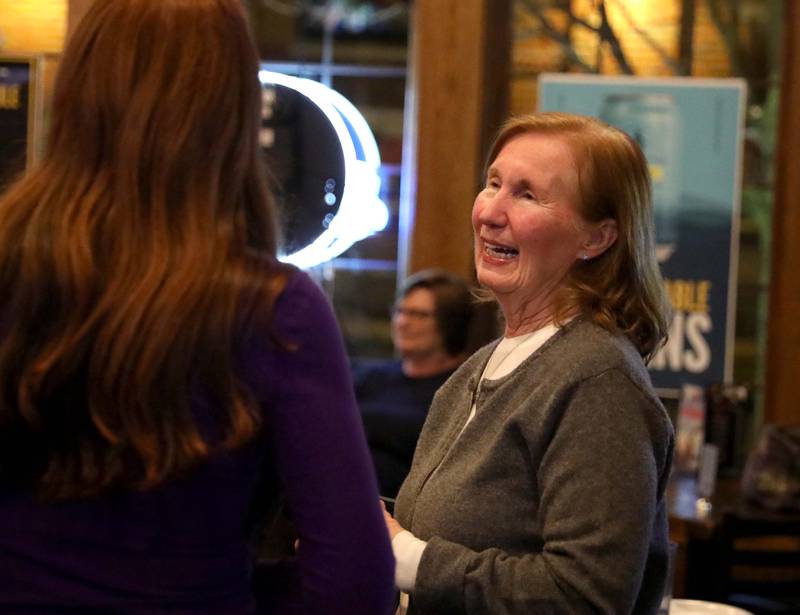 Barbara Wojnicki, candidate for Campton Hills Village President, smiles with friends at the Old Towne Pub in Campton Hills as they await election results following the Consolidated Election on Tuesday, April 4, 2023.