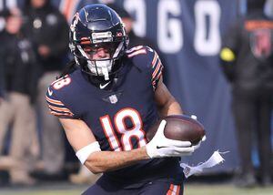 Chicago Bears new player wide receiver DJ Moore smiles as he listens to a  question from the media during an NFL football news conference at Halas  Hall in Lake Forest, Ill., Thursday