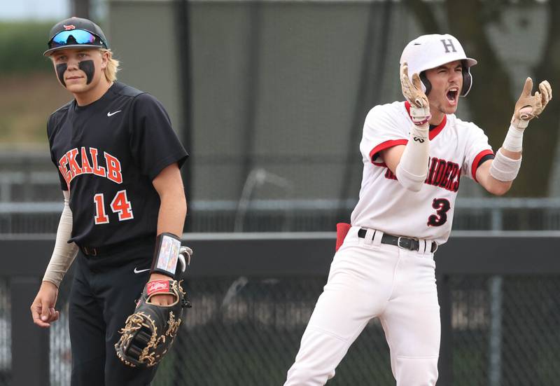 Huntley's Griffin Goldstein celebrates his RBI single as DeKalb’s Brodie Farrell walks away during their Class 4A DeKalb Regional championship game Friday, May 24, 2024, at Ralph McKinzie Field at Northern Illinois University in DeKalb.
