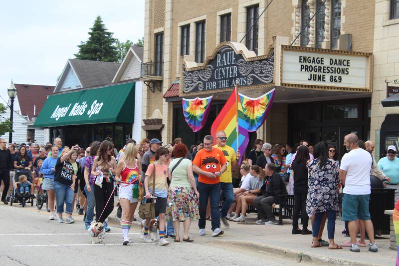 People of all ages with rainbow pride flags, balloons and attire walked from the intersection of Crystal Lake Avenue and Williams Street to downtown’s Depot Park for the Downtown Crystal Lake/Main Street Pride Walk & Social.
