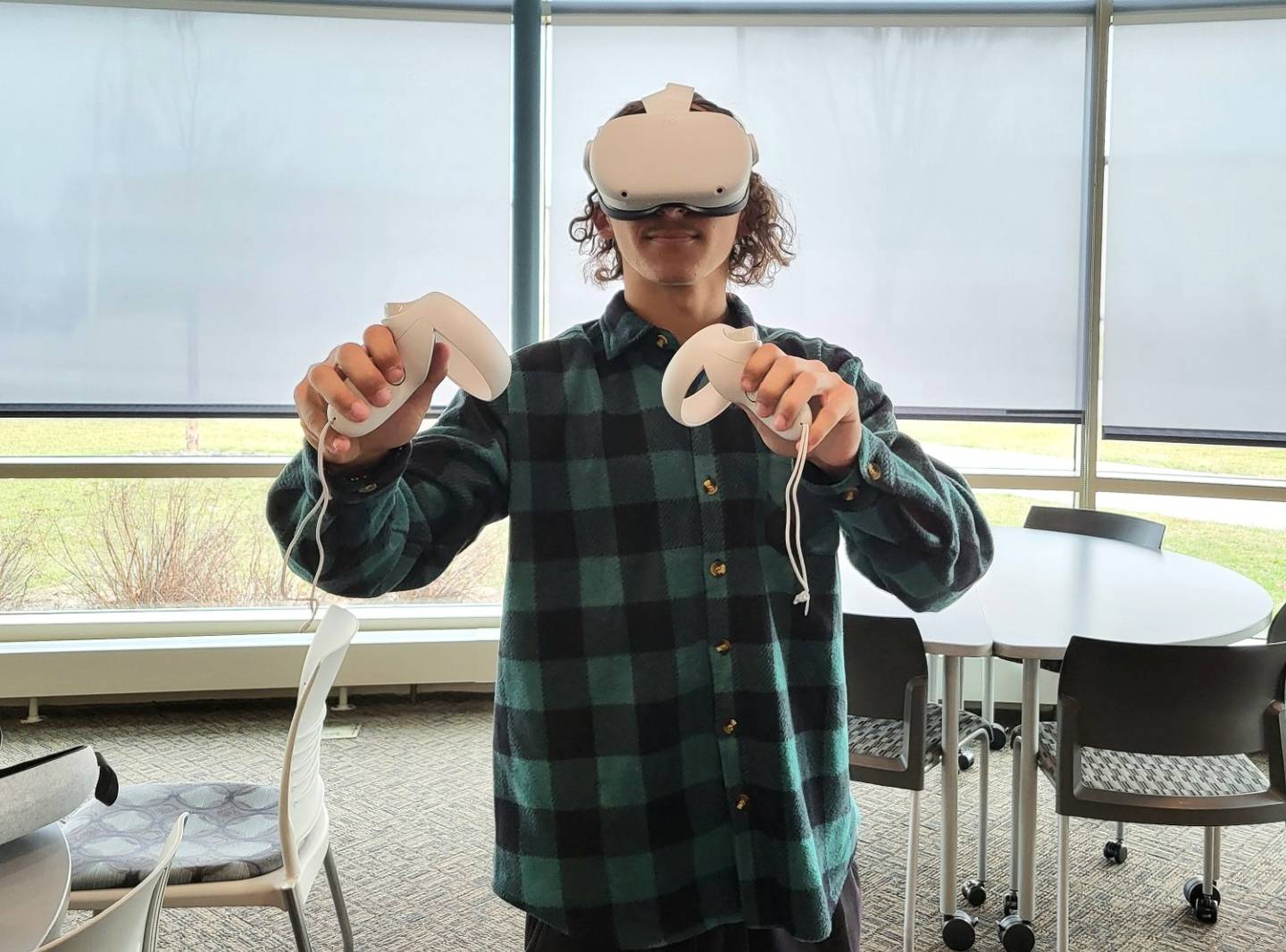 Elgin Community College student Chris Lara, of Streamwood, tries one of the college's virtual reality headsets to see if a job in health care is a right fit for him. The college was one of a dozen community colleges to receive an Illinois Community College Board grant to buy 11 headsets and equipment.