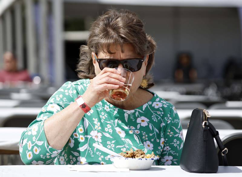 Marla Shega of Geneva samples a glass of wine at the Festival of the Vine Friday, Sept. 6, 2024 in Geneva.