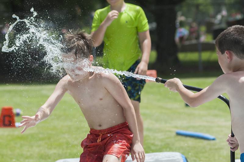 Barrett Weigle, 9, gets blasted in the face by Easton Faivre, 9, Wednesday, June 15, 2022 at SPARK Camp.