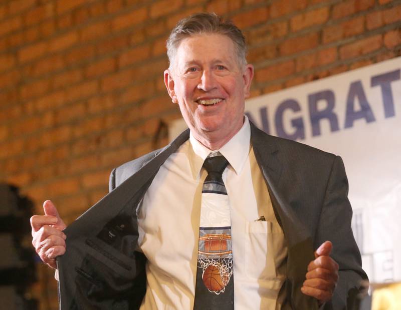 Mike Kilmartin shows off his basketball tie during the Illinois Valley Sports Hall of Fame awards banquet on Thursday, June 6, 2024 at the Auditorium Ballroom in La Salle.