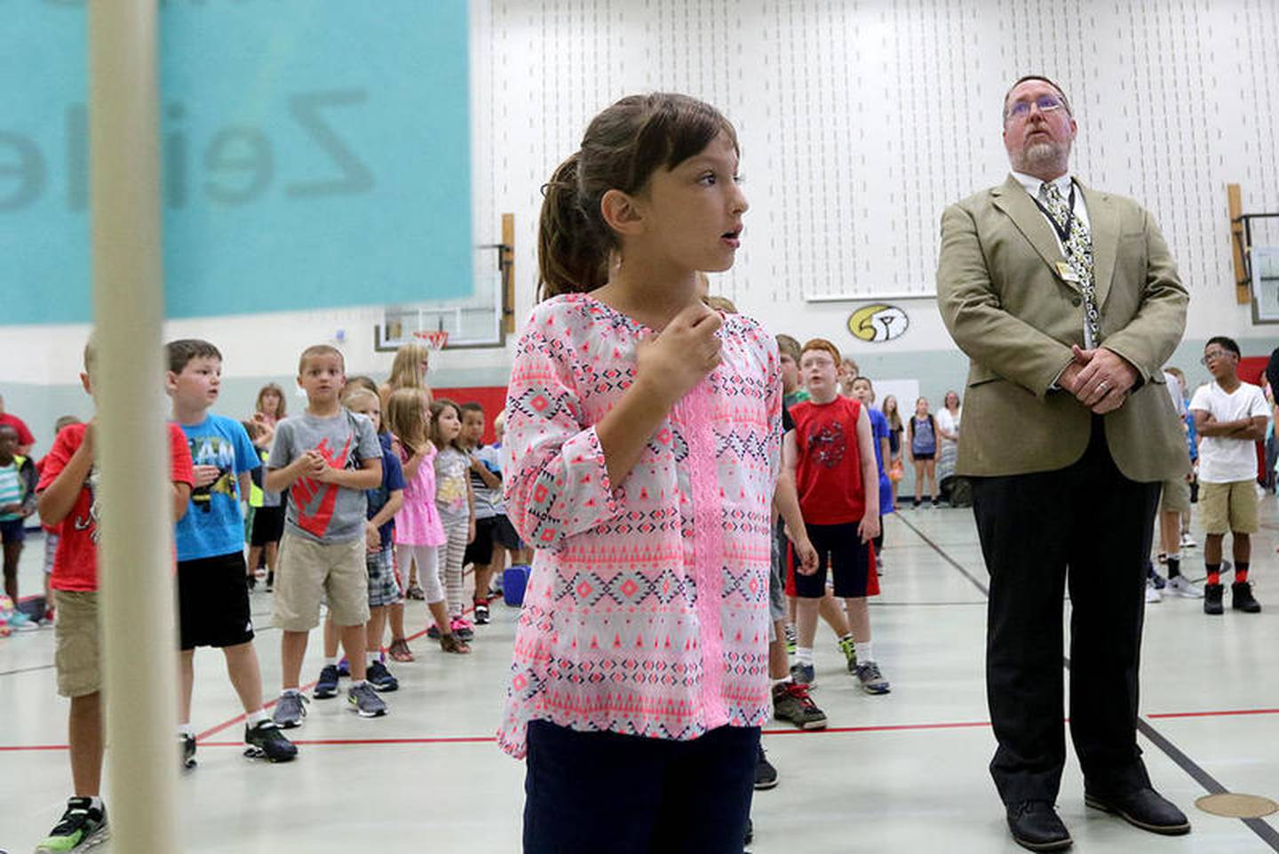 (Caption: South Prairie Elementary School third grade student Jenna Garnet (center) sings the school song along with classmates and principal Kreg Wesley (right) during the first day of school on Wednesday, Aug. 16, 2017 at South Prairie Elementary School in Sycamore.)

Samples must be sent to an Illinois Environmental Protection Agency-accredited lab, and test results will be sent the Illinois Department of Public Health.

The state requires that any potable water source that tests at more than 20 parts per billion must be remediated, meaning fixing pipes and other infrastructure.