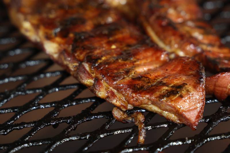 Rib that have been cooking for three hours in the aquarium cooker wait to be cut up at Chicago Style BBQ on Wednesday, May 29, 2024 in Joliet.