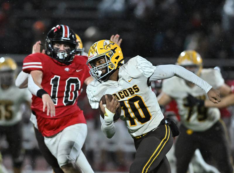 Jacobs' Jayden Gaona tries runs the ball during a Class 7A first-round playoff game against Lincoln-Way Central on Friday, Oct. 27, 2023, at New Lenox.