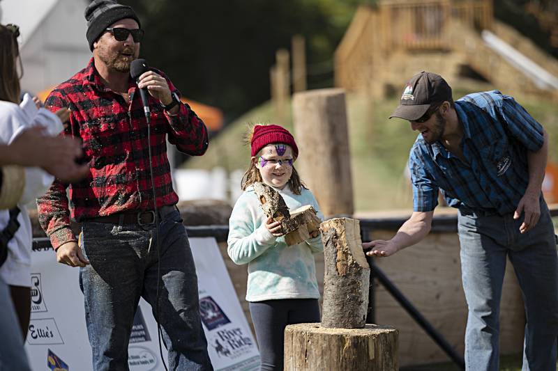 Avery Gonzalez, 7, of Rock Falls, wins the carved chair for the best chainsaw impersonation Saturday, Oct. 7, 2023.