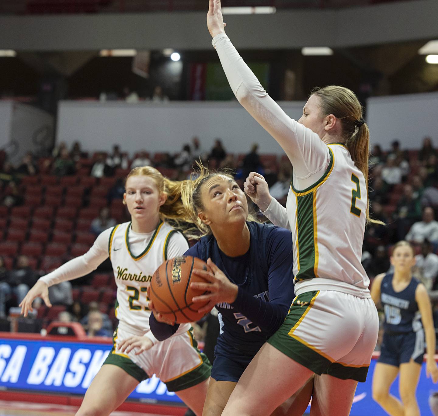 Nazareth Academy’s Olivia Austin looks to put up a shot against Waubonsie Valley’s Hannah Laub Friday, March 1, 2024 in the girls basketball 4A state semifinal at CEFCU Arena in Normal.