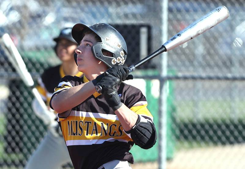 Metea Valley's Michael Bryant watches his ball head into centerfield during their game against DeKalb Thursday, April 13, 2023, at DeKalb High School.