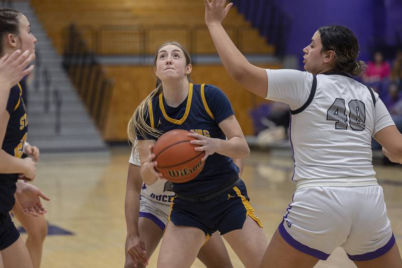 Sterling’s Olivia Melcher looks to put up a shot against Dixon Tuesday, Feb. 13, 2024 during a regional semifinal at Rochelle.