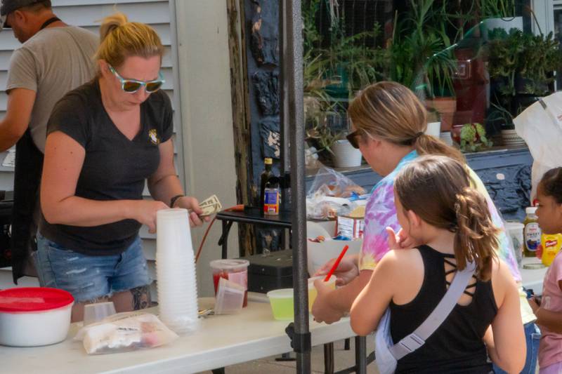 People of Ladd purchase concession items on Saturday, July 20, 2024 at the Convoy Against Cancer Big Truck Show on Main Avenue in Ladd.