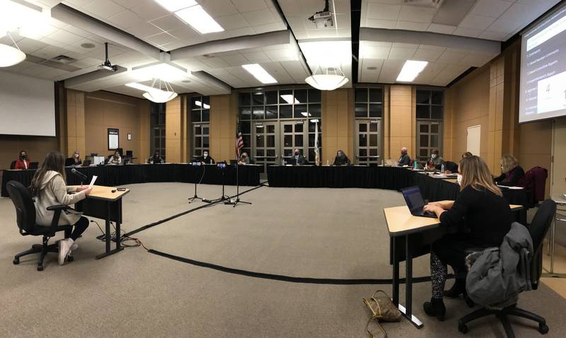 A student addresses the Oswego SD308 School District Board of Education and district administrators during a board meeting Monday evening, March 15, in the Community Room at Oswego East High School.