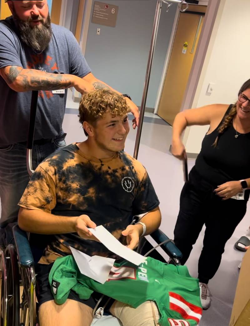 La Salle-Peru junior Dane Wicinski smiles as he talks to his teammates and coaches Thursday at OSF. Wicinski injured his left leg in Week 2 at Metamora. He's had multiple surgeries and needs two or three more, L-P coach Jose Medina said.