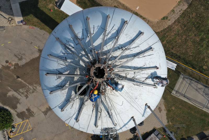 Crews are in the beginning stages of painting the Utica water towner on top of Clarks Hill on Wednesday, Sept. 18, 2024 in Utica. Crews will be doing repairs to the interior and exterior of the tower before painting. When finished, the tower will have a new logo on it.