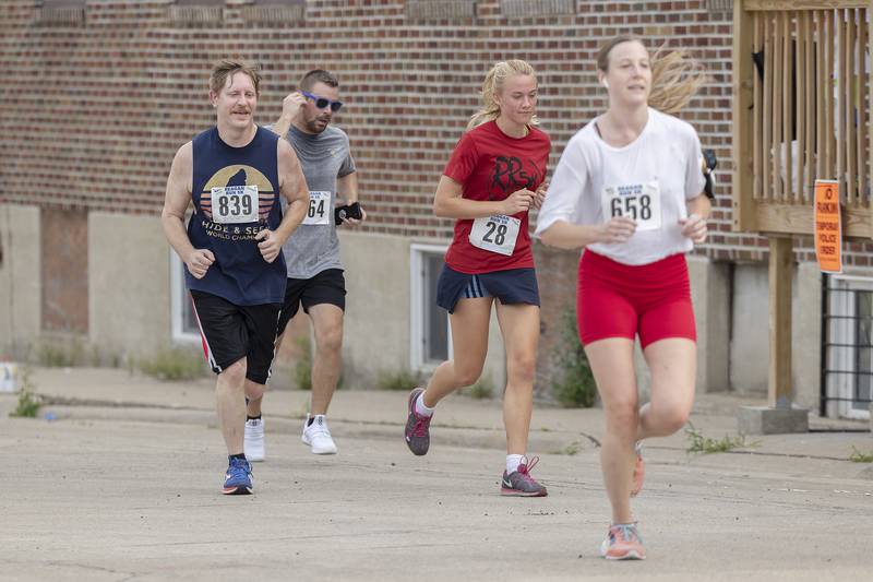 Runners near the finish Saturday, July 1, 2023 in the 23rd annual Reagan Run in Dixon. The 5K starts at the Reagan Boyhood home and ends at Haymarket Square.