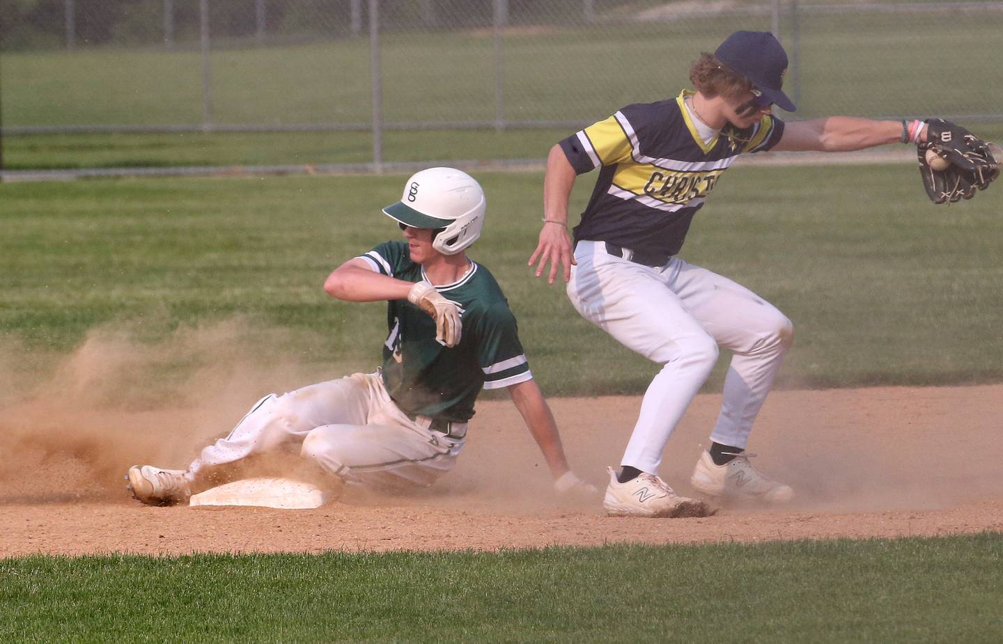 St. Bede's Alex Ankieicz steals second base as the throw comes late into the glove of Yorkville Christian's Reese Seng in the Class 1A Regional semifinal game on Thursday, May 18, 2023 at Masinelli Field in Ottawa.