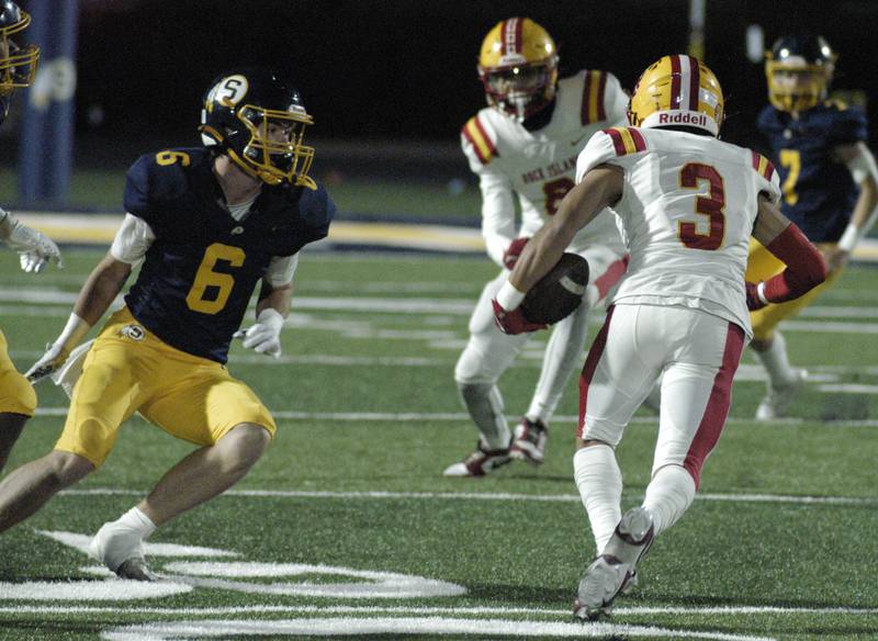 Rock Island's Elijah Venegas sidesteps Sterling's Jimmy Wadsworth. Action took place on Friday, October  18th, 2024 in Sterling.